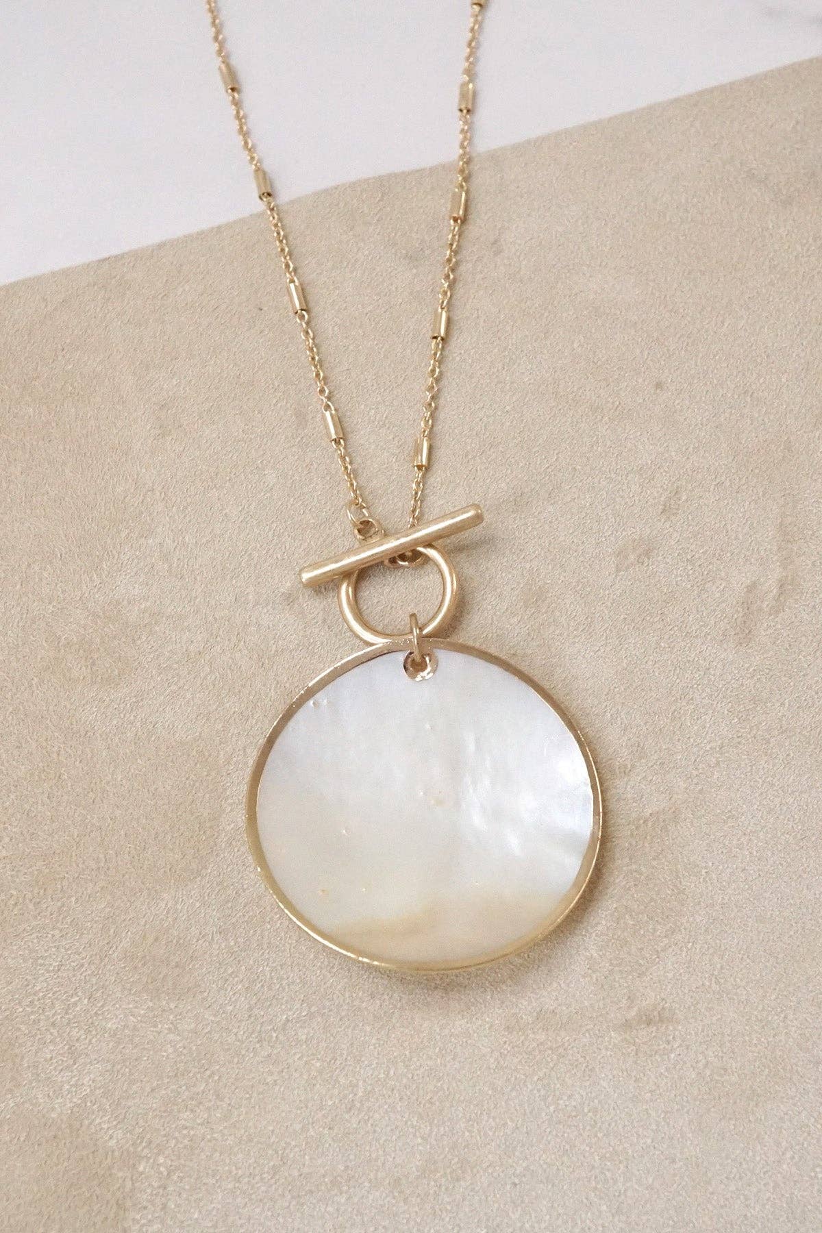 Minimalist boho short gold necklace with golden framed round shell