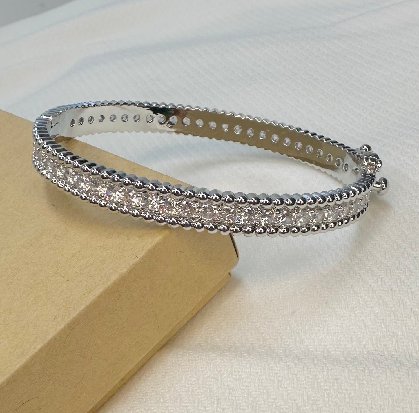 Single row diamond and silver bangle